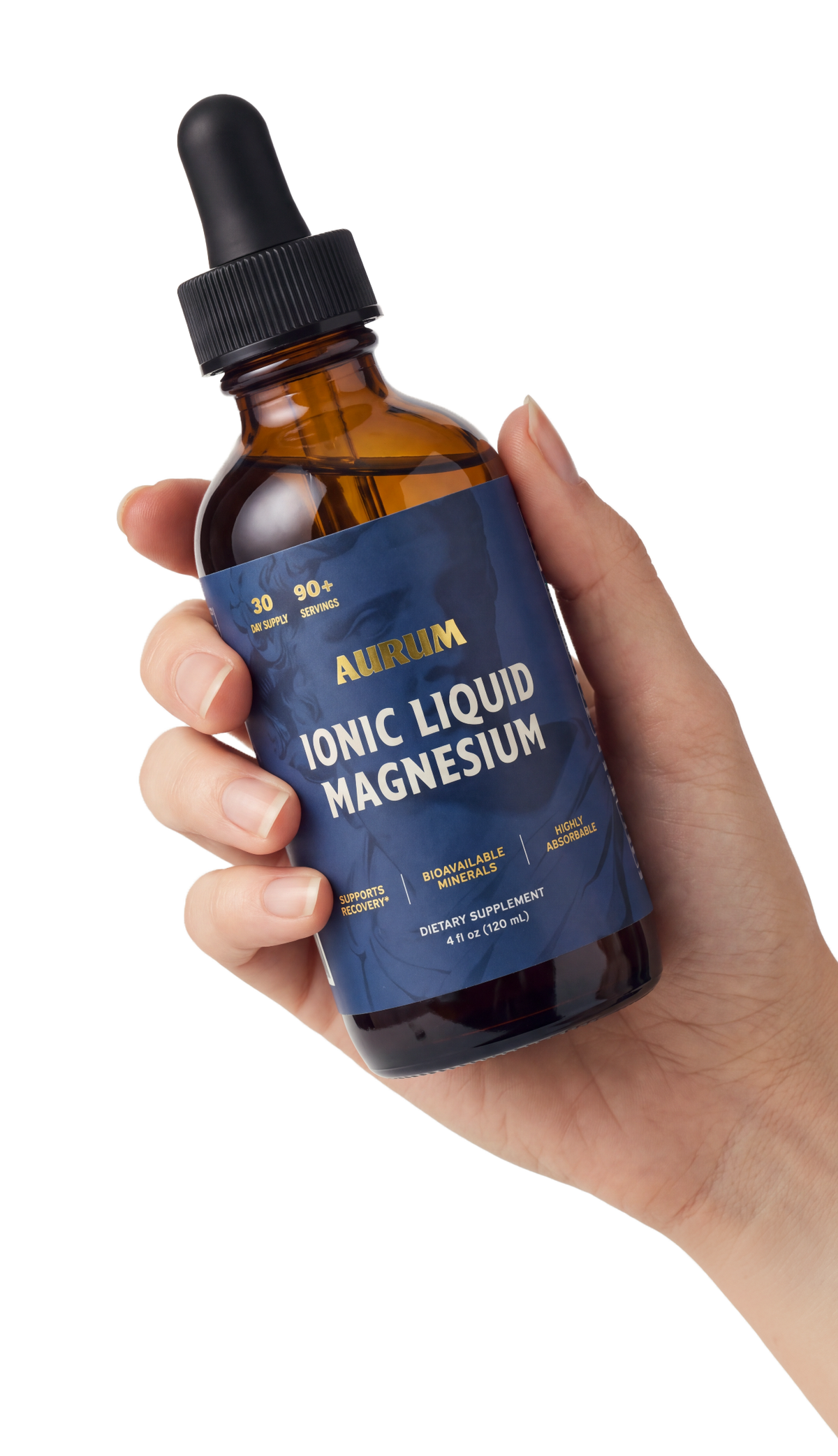 Hand holding an Aurum Ionic Liquid Magnesium dropper bottle