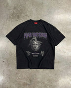Black t-shirt with graphic design on a textured gray surface