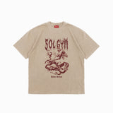 Beige t-shirt with red graphic design and 'SOLGYM' text on a white background