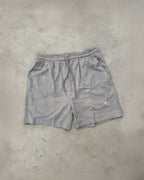 Ash grey Sol Dept. cotton gym shorts on a gray concrete surface